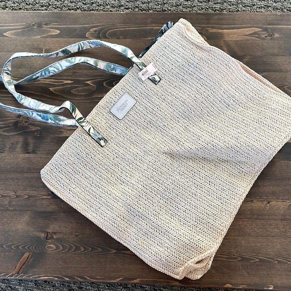 Victoria’s Secret natural woven tote with tropical leaves interior